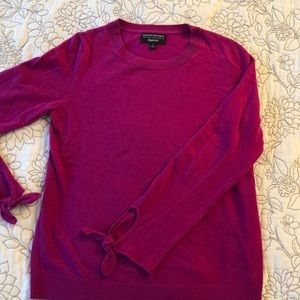 Dark pink wool sweater with tie wrist feature